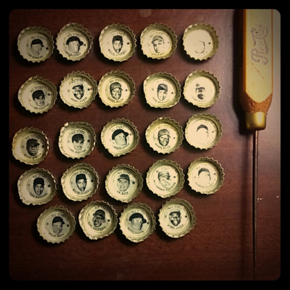 All star coke bottle caps and Pepsi cola ice pick.